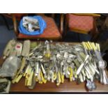 A mixed lot of silver plated cutlery to include fish servers, cake servers, miscellaneous knives and