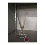 An 1830s ale glass of conical form, engraved with acorns and leaves, initialled and dated 1838, on a