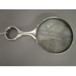 An Edwardian silver handled magnifying lens, London 1904, stamped Goldsmith Company