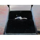 A 9ct white gold and diamond solitaire ring