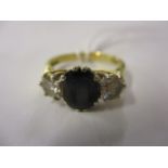 A diamond and sapphire ring set in 18ct gold