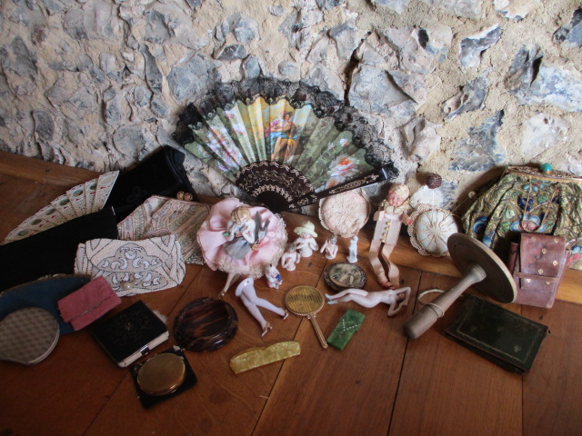 An interesting lot comprising vintage purses, some beaded, compacts, pin cushions, dressing table