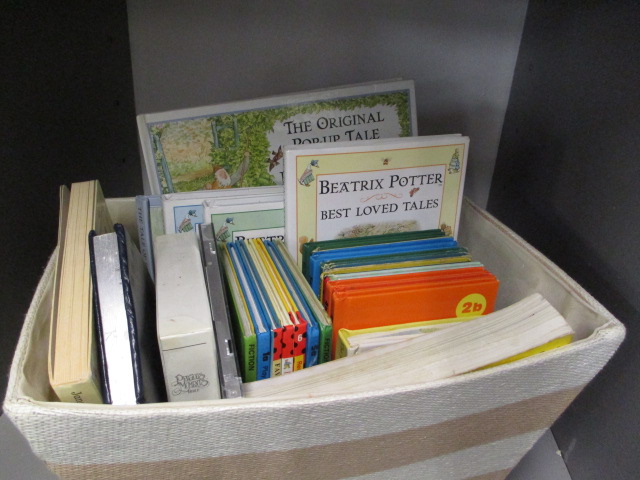 A small quantity of vintage childrens' Ladybird books and Peter Rabbit pop-up books, together with a