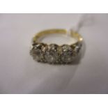 A diamond three stone ring set in 18ct gold