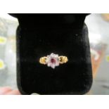 An 18ct yellow gold, diamond and ruby flower head cluster ring