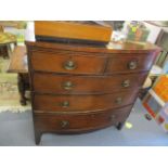 A Georgian mahogany, bow fronted chest of two short and three long drawers