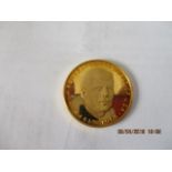 A German gold coin commemorating John F Kennedy 35 President of USA 1917-1963, 900/1000, 26mm dia,