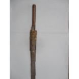 A late 19th/ 20th century Malaysian Bolo type short machete with part of the wooden scabbard tied