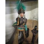 A vintage metal armour knight puppet, marionette