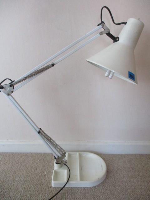 A Flemish enamelled anglepoise desk lamp with an enamelled base