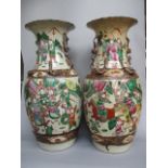 A matched pair of late 18th century Chinese Nanking crackle glazed famille verte vases of ovoid