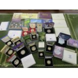 A selection of cased coins sets and silver proof coins to include a 2007 Diamond Wedding, silver