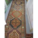 Three rugs to include a Caucasian design runner, 84" l x 25"w, a modern grey rug, 78" x 52" and a