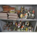 A mixed lot to include porcelain military figures, books and albums of Brook Bond cards