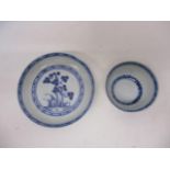 A Nanking Cargo, mid 18th century Chinese tea bowl and saucer, decorated in blue and white with