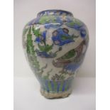 A late 19th century Persian vase decorated with flowers and foliage, in green, blue and brown, 11" h