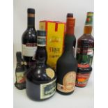Eight mixed bottles to include Calvados and Grand Marnier