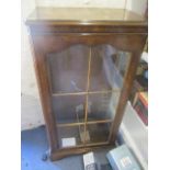 A reproduction burr walnut glazed bookcase, 48" h x 24" w