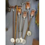 A selection of shooting sticks and walking sticks