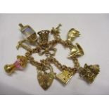 A 9ct gold bracelet and charms