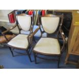 A pair of late Victorian/Edwardian mahogany inlaid, shield back armchairs, standing on tapering legs