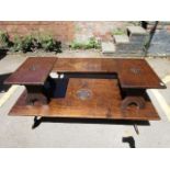 Four dark oak tables comprising two coffee tables and two matching smaller tables, carved with a