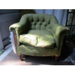 An early 20th century upholstered tub chair, raised on square, tapering, mahogany fore legs