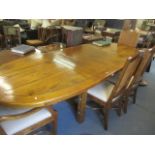 A large modern American walnut dining table, 30 1/4"h x 102 1/2w and a set of eight cane backed