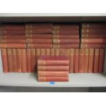 A collection of antiquarian, well known novels in red binders