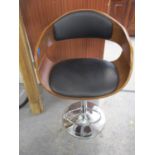 A modern laminated and chrome bar stool