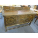An early 20th century oak carved sideboard, 41 1/4"h x 58 3/4"w