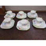 A Shelley six place setting teaset, decorated with flowers, comprising cups, saucers and plates
