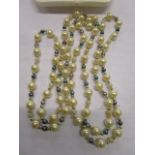 A Mallorca pearl beaded necklace with blue and silver coloured spacers, cased