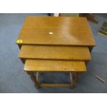 A nest of three modern oak tables, the largest 16" h x 20"w, along with a reproduction firescreen, a