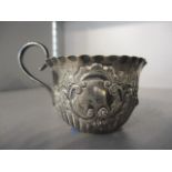 A Victorian small silver embossed jug