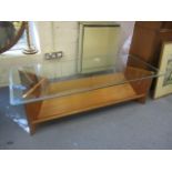 A G-Plan teak and glass topped coffee table, 14 3/4" h, 53" w