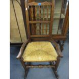 A reproduction rush seated rocking chair