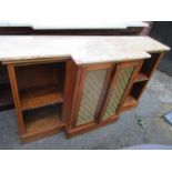 A Victorian marble topped satinwood breakfront sideboard having two grill fronted doors and open