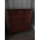 A modern cherry wood chest of two short and three long drawers, raised on square tapered legs, 46"