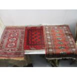 Three Bokhara rugs, each with gulls on a red ground, the largest 38" x 26"