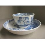 A late 18th century Chinese blue and white tea bowl and saucer