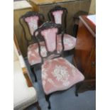 A set of three late Victorian mahogany carved framed salon chairs with upholstered back and seat,