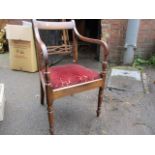 A Georgian carver chair with scrolled arms, pierced splat, drop in seat on turned front legs with