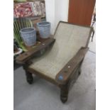 A 20th century Colonial plantation chair