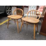 A pair of Ercol dressing chairs