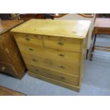 A Victorian pine chest of two short and three long drawers, on plinth base