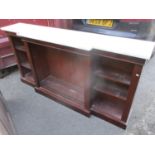 A Victorian mahogany marble topped breakfront sideboard having open shelves, standing on a plinth