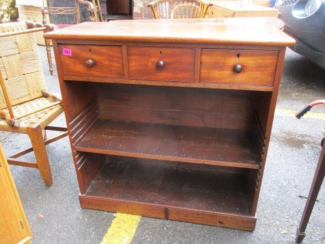 A Victorian bookcase with three short spice drawers above, standing on a plinth base, 31" h x 31 3/