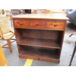 A Victorian bookcase with three short spice drawers above, standing on a plinth base, 31" h x 31 3/