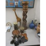 Carved wooden and other items to include a composition model elephants, drums, a mask, a giraffe,